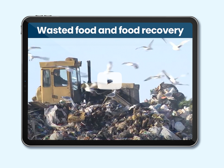 Bulldozer pushing garbage in a waste management plant. Text on image: Wasted food and food recovery