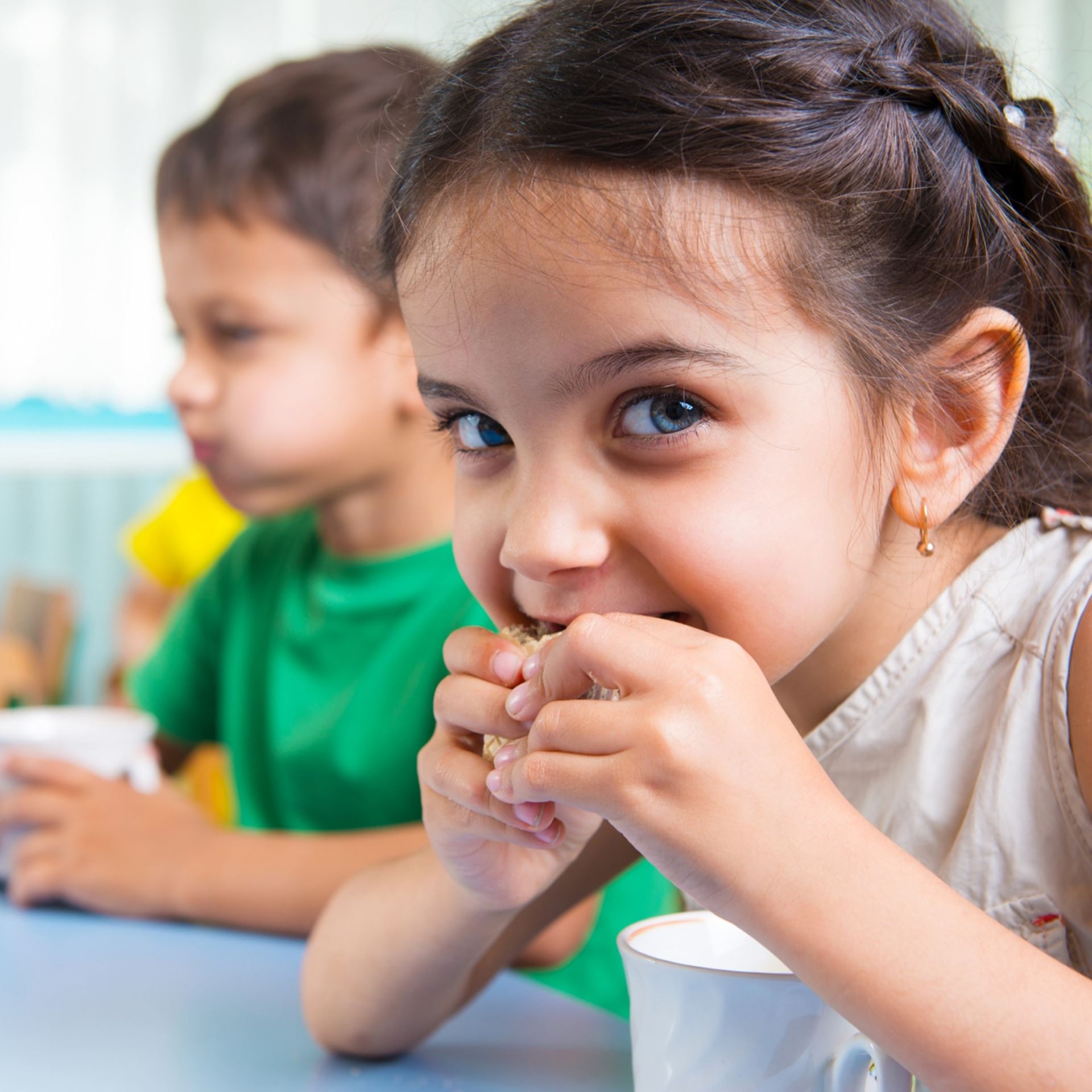Young girl eating in class
