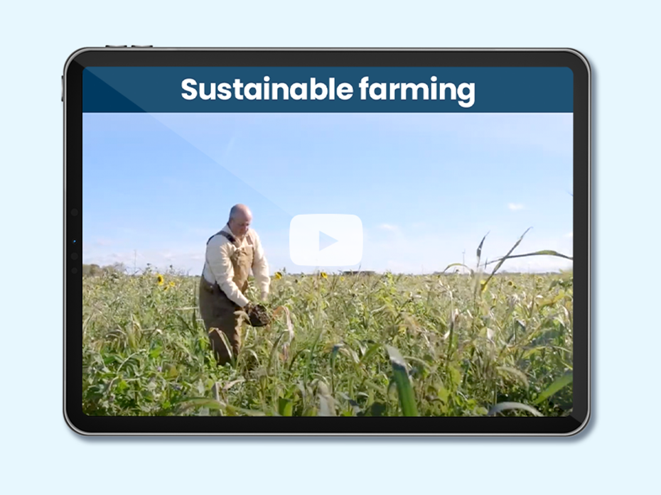 A farmer working in the field. Text on screen: Sustainable farming
